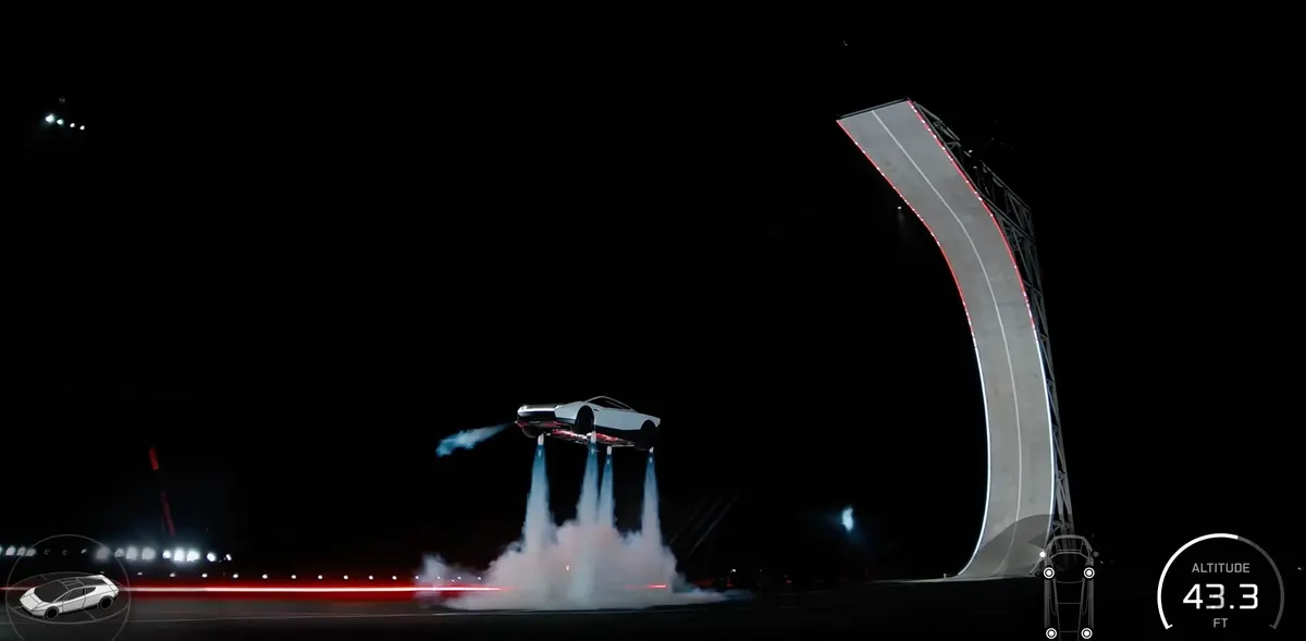 Roadster парит над землёй на четырёх струях газа и дыма, справа рампа; высота 43,3 фута