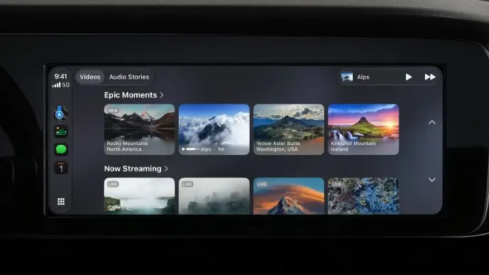 Экран CarPlay в машине: раздел видео с горными пейзажами, подборки Epic Moments и Now Streaming